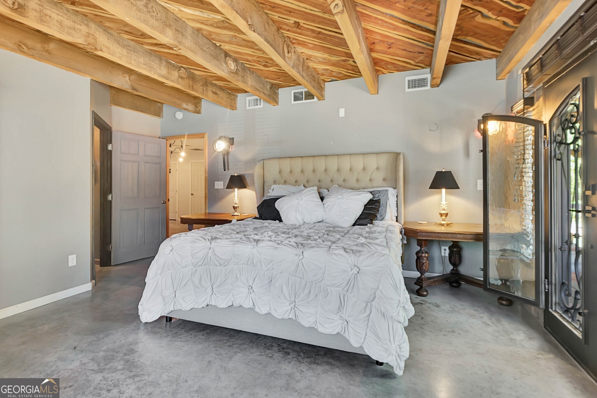 860 North Walker's Mill Road Griffin, GA 30223 - Photo 47 of 116 a bedroom with a bed and a table