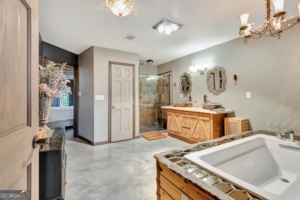a living room with furniture tv and large windows