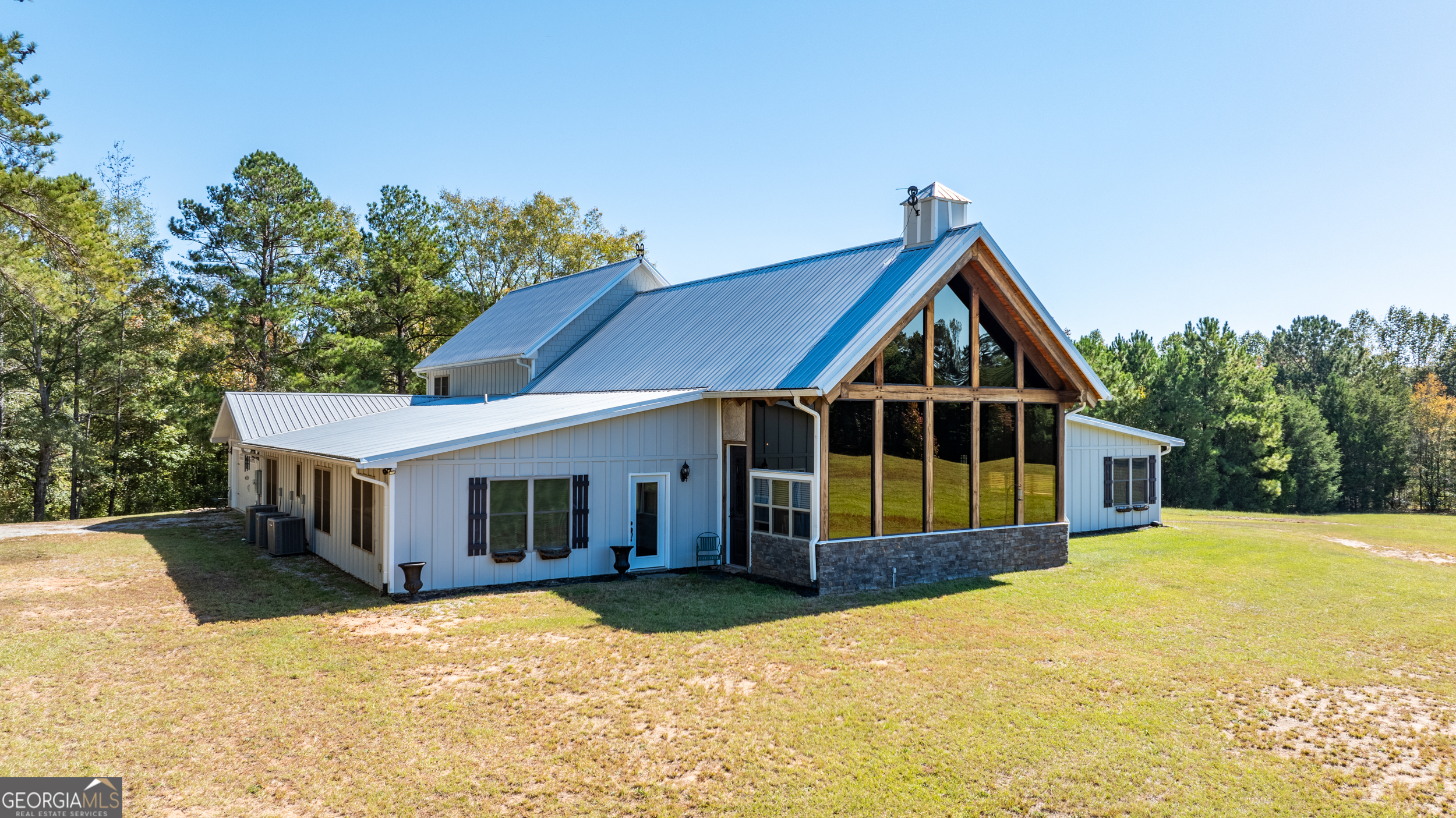 860 North Walker's Mill Road Griffin, GA 30223 - Photo 7 of 116 a front view of a house with yard and glass windows