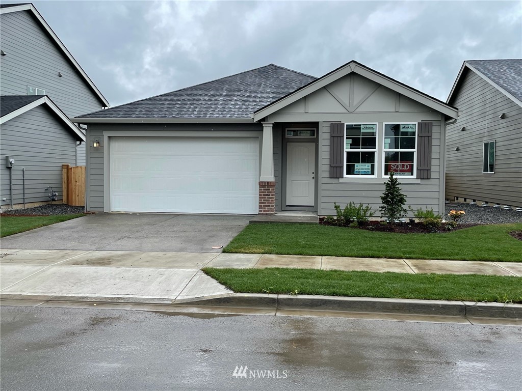 3813 South 41st Place Ridgefield, WA 98642 - Photo 1 of 1 a front view of a house with a yard