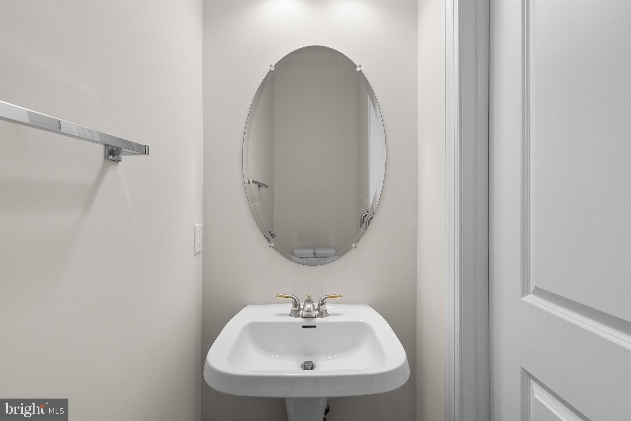 2788 Westminster Road Ellicott City, MD 21043 - Photo 22 of 75 a bathroom with a sink and a mirror
