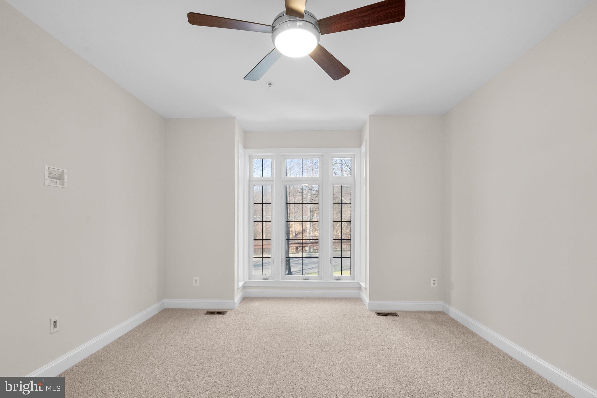 2788 Westminster Road Ellicott City, MD 21043 - Photo 24 of 75 an empty room with chandelier fan