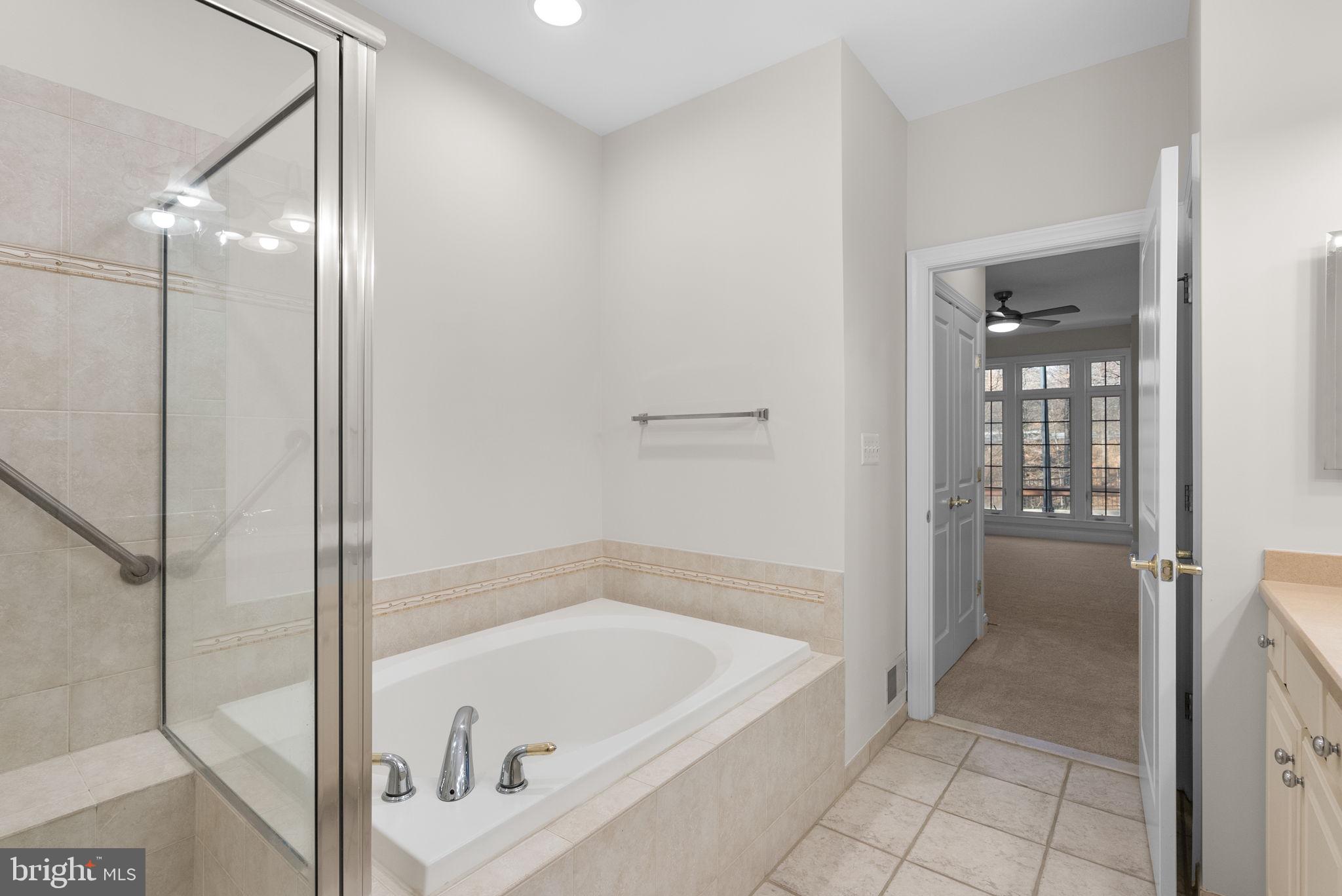 2788 Westminster Road Ellicott City, MD 21043 - Photo 28 of 75 a bathroom with a tub and shower