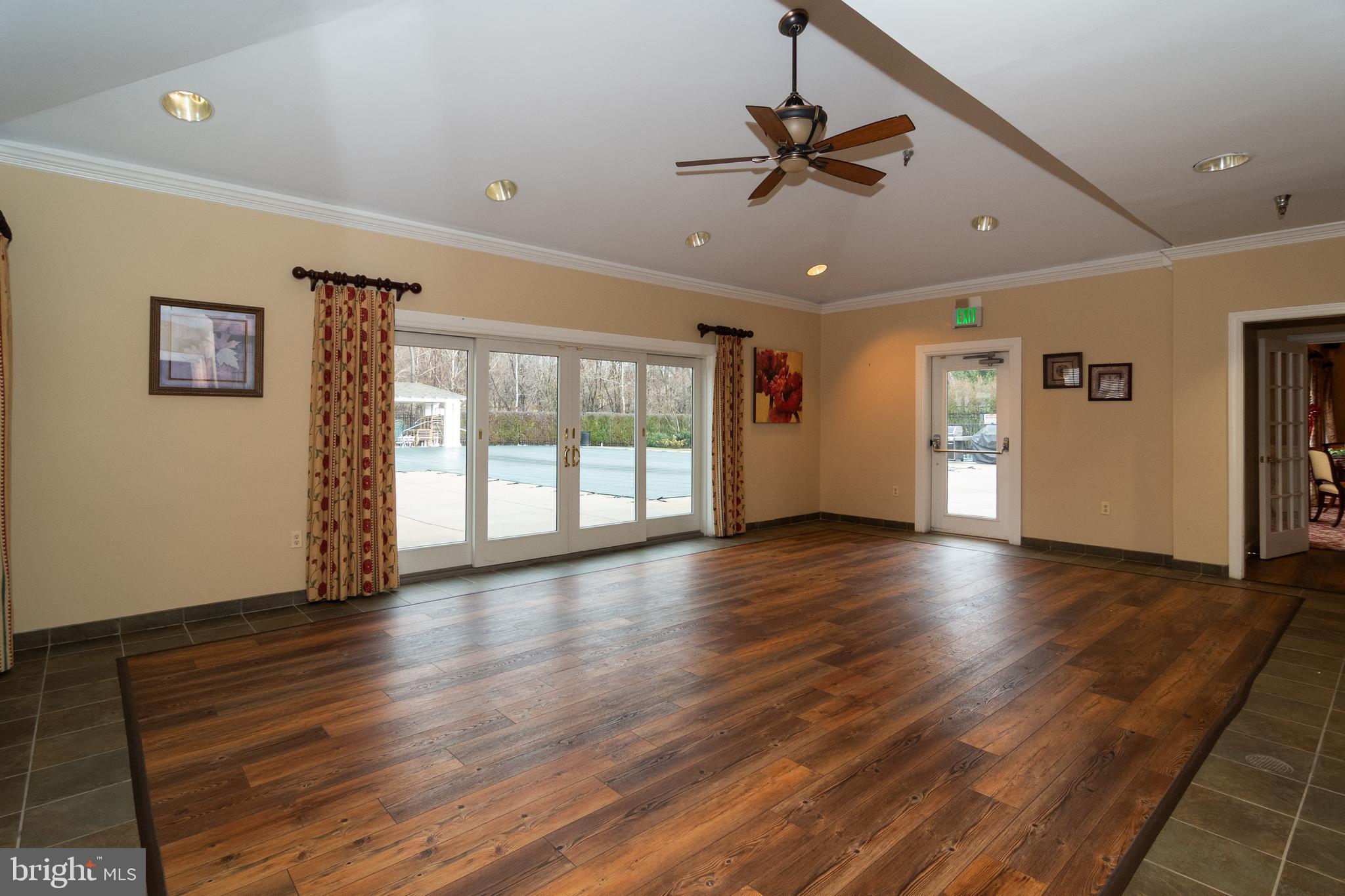 2788 Westminster Road Ellicott City, MD 21043 - Photo 66 of 75 a view of an empty room with wooden floor and a window
