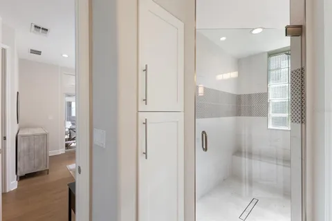 a bathroom with a shower and a sink