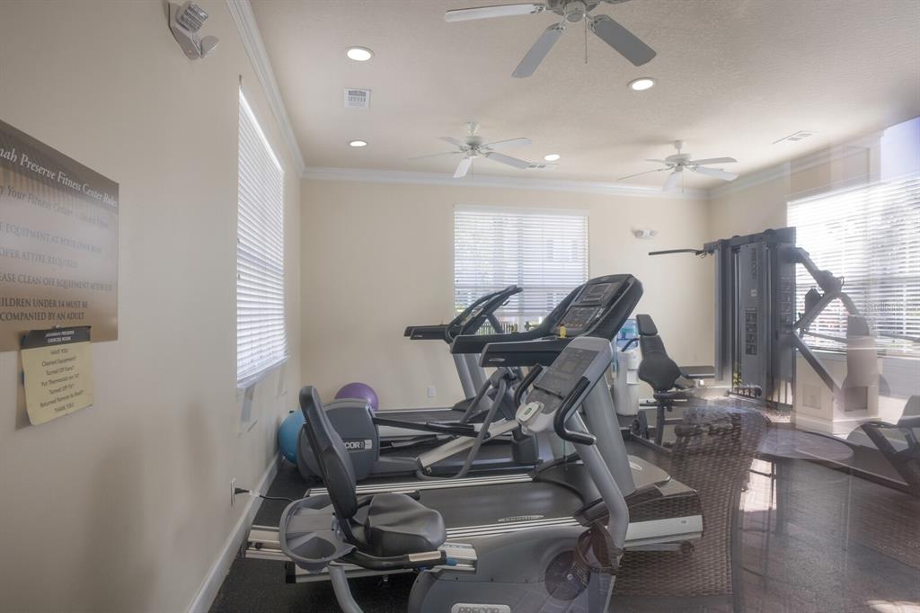 8035 St Simons Street, Unit 8035 University Park, FL 34201 - Photo 28 of 33 a view of workspace with wooden floor windows and a ceiling fan