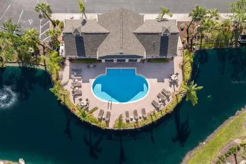 an aerial view of a house with outdoor space pool seating area and outdoor seating