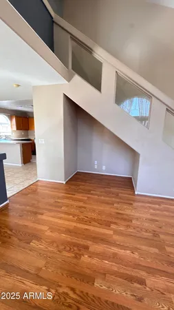 a kitchen with stainless steel appliances a stove sink microwave and window