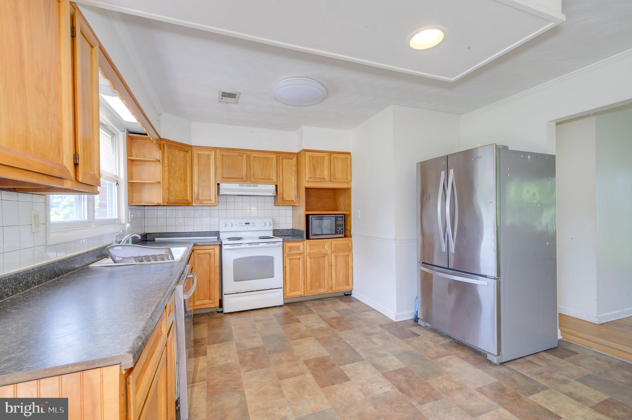3208 Old Leetown Pike Ranson, WV 25438 - Photo 15 of 48 a kitchen with stainless steel appliances granite countertop a refrigerator and a sink