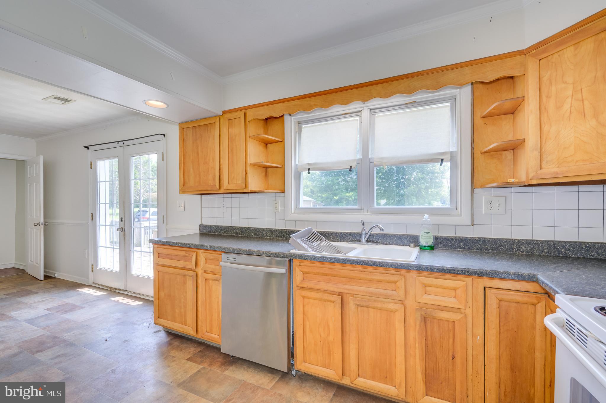3208 Old Leetown Pike Ranson, WV 25438 - Photo 16 of 48 a kitchen with granite countertop cabinets stainless steel appliances a sink and a window