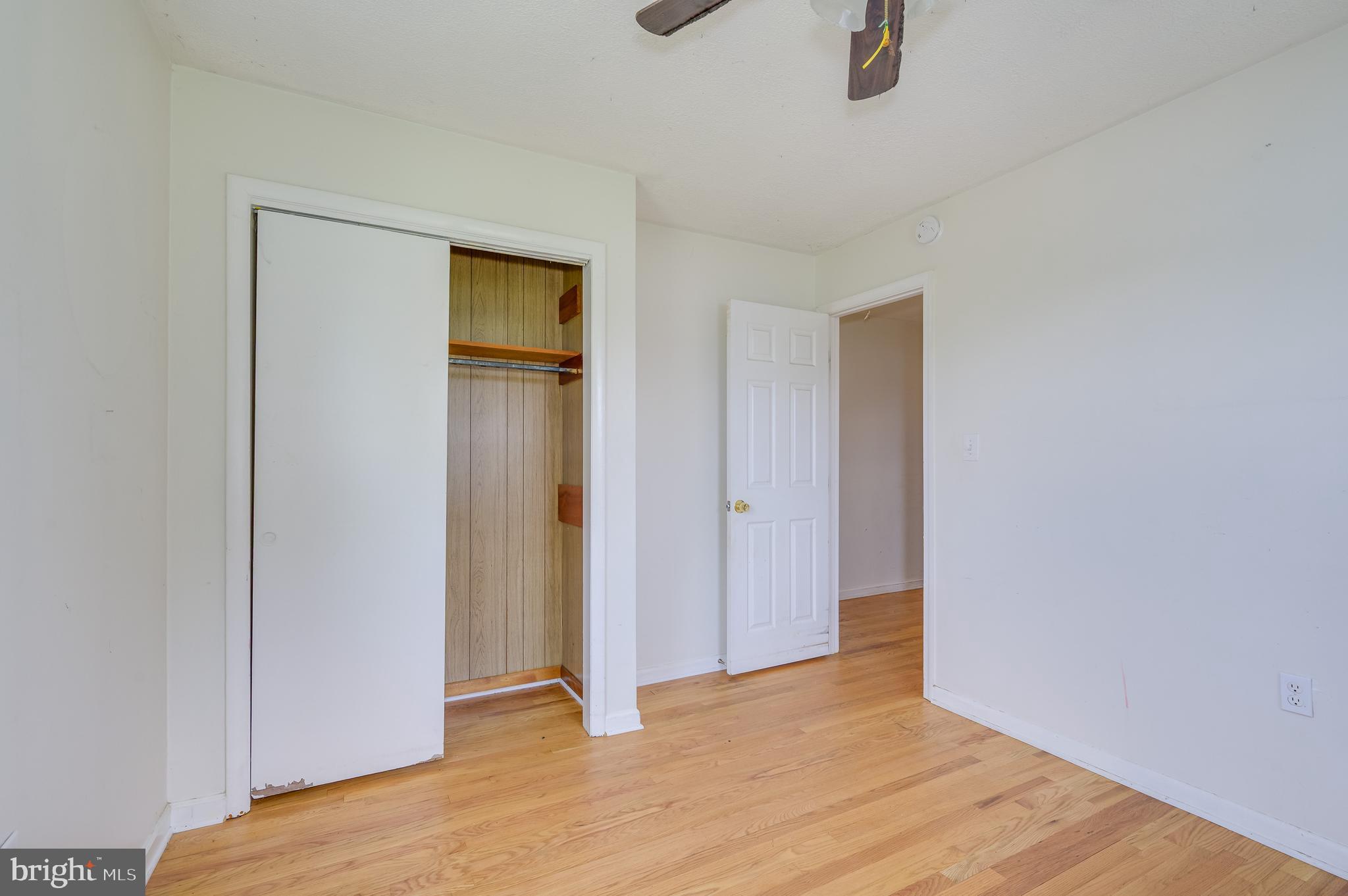 3208 Old Leetown Pike Ranson, WV 25438 - Photo 21 of 48 a view of an empty room with wooden floor and closet