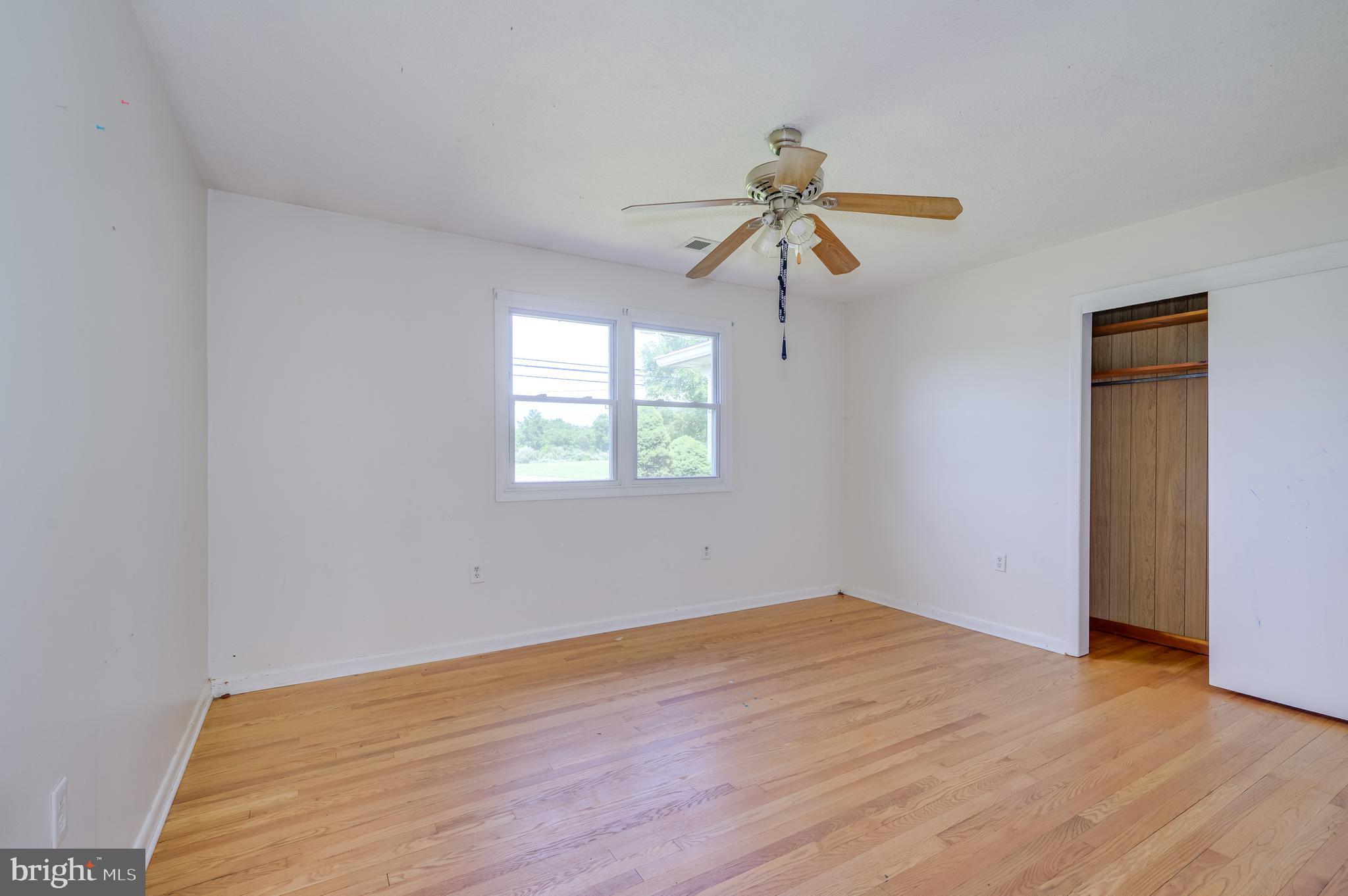 3208 Old Leetown Pike Ranson, WV 25438 - Photo 23 of 48 a view of a room with wooden floor and fan