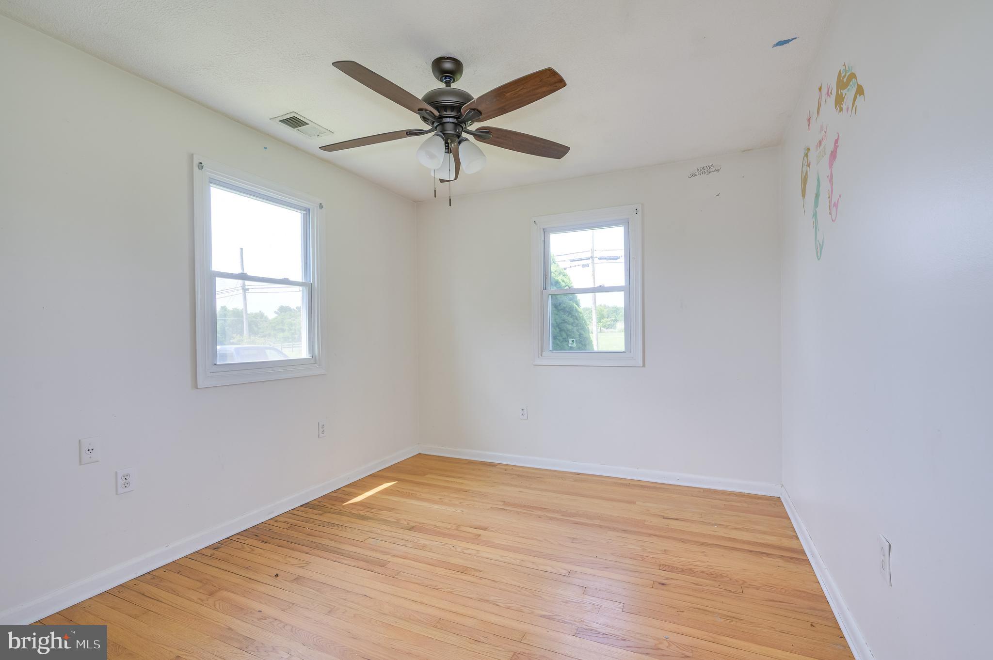 3208 Old Leetown Pike Ranson, WV 25438 - Photo 25 of 48 a view of a big room with wooden floor closet and windows