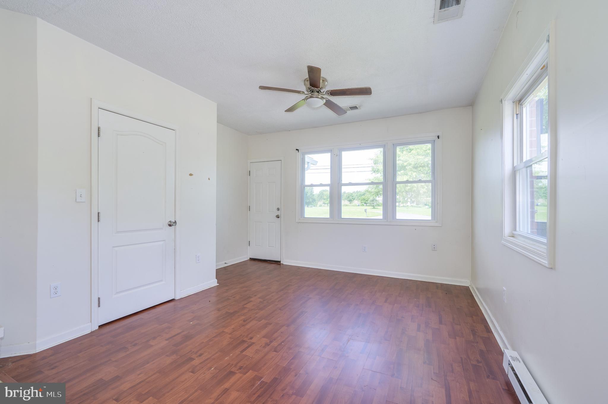 3208 Old Leetown Pike Ranson, WV 25438 - Photo 30 of 48 wooden floor in an empty room with a window
