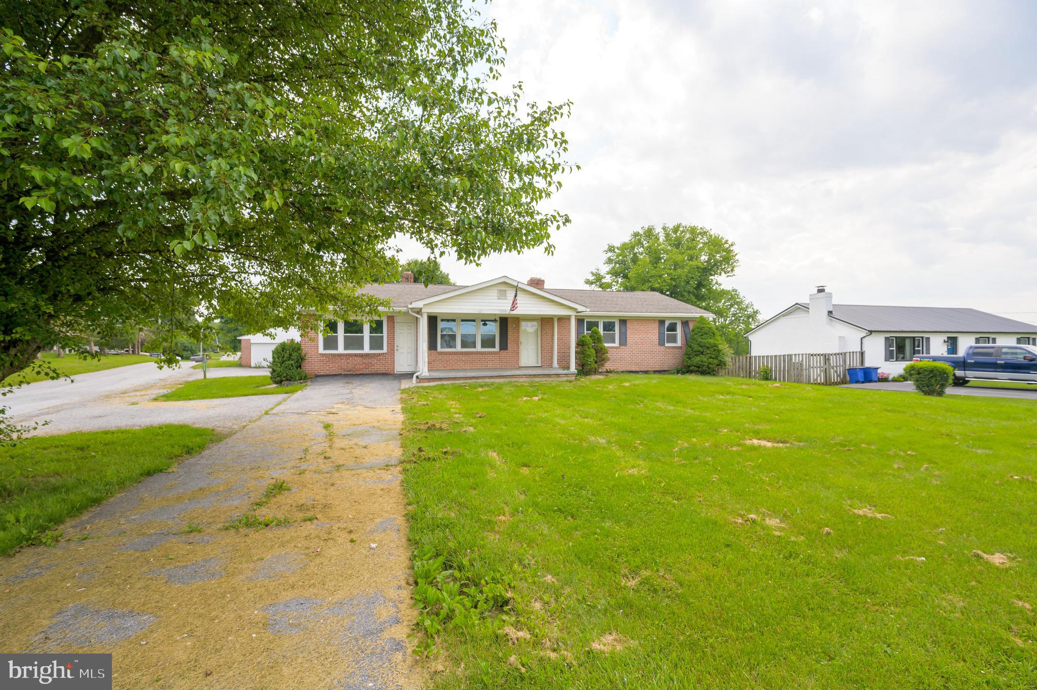 3208 Old Leetown Pike Ranson, WV 25438 - Photo 3 of 48 a front view of house with yard and green space