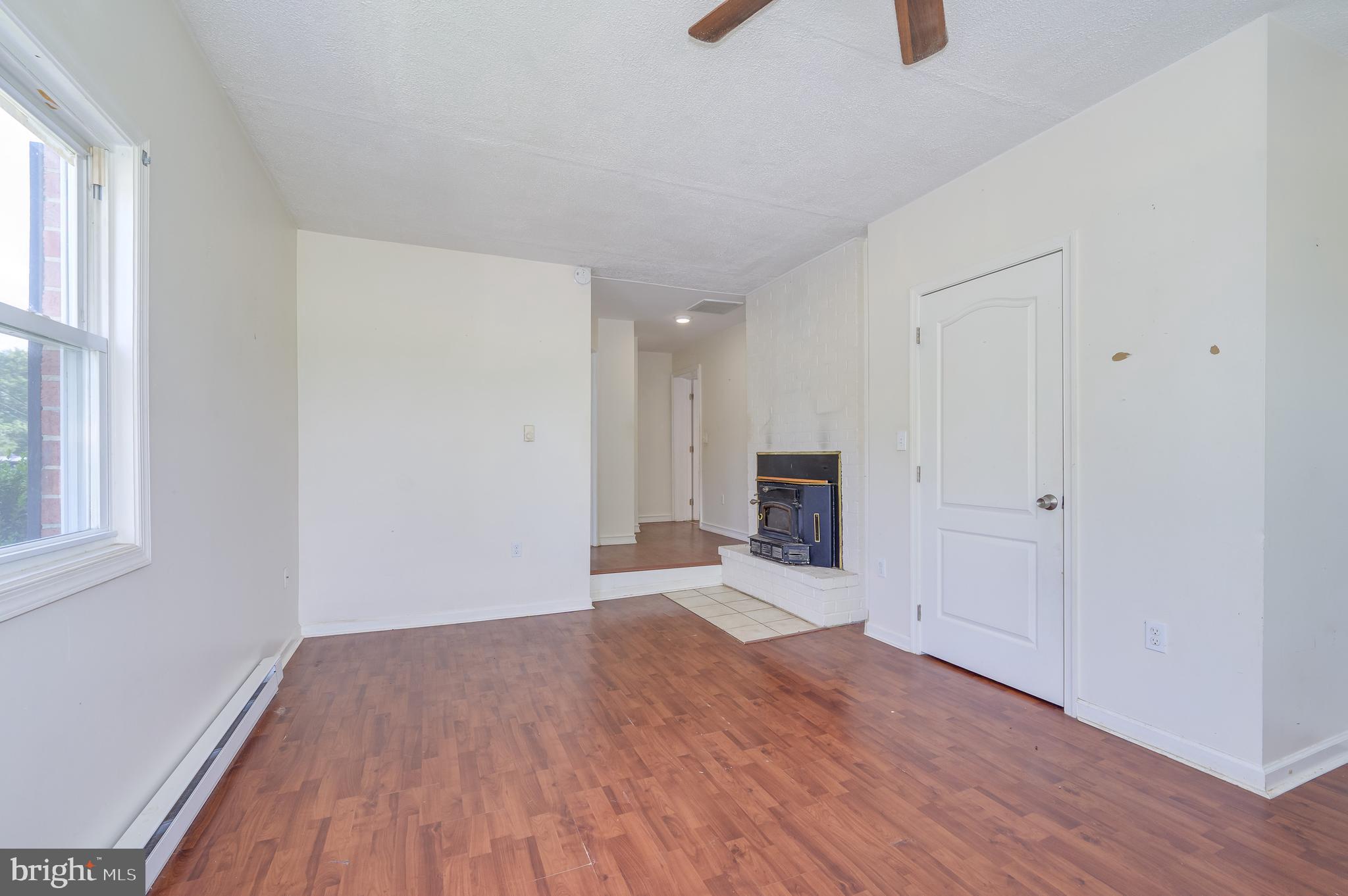 3208 Old Leetown Pike Ranson, WV 25438 - Photo 31 of 48 a view of empty room with wooden floor and window