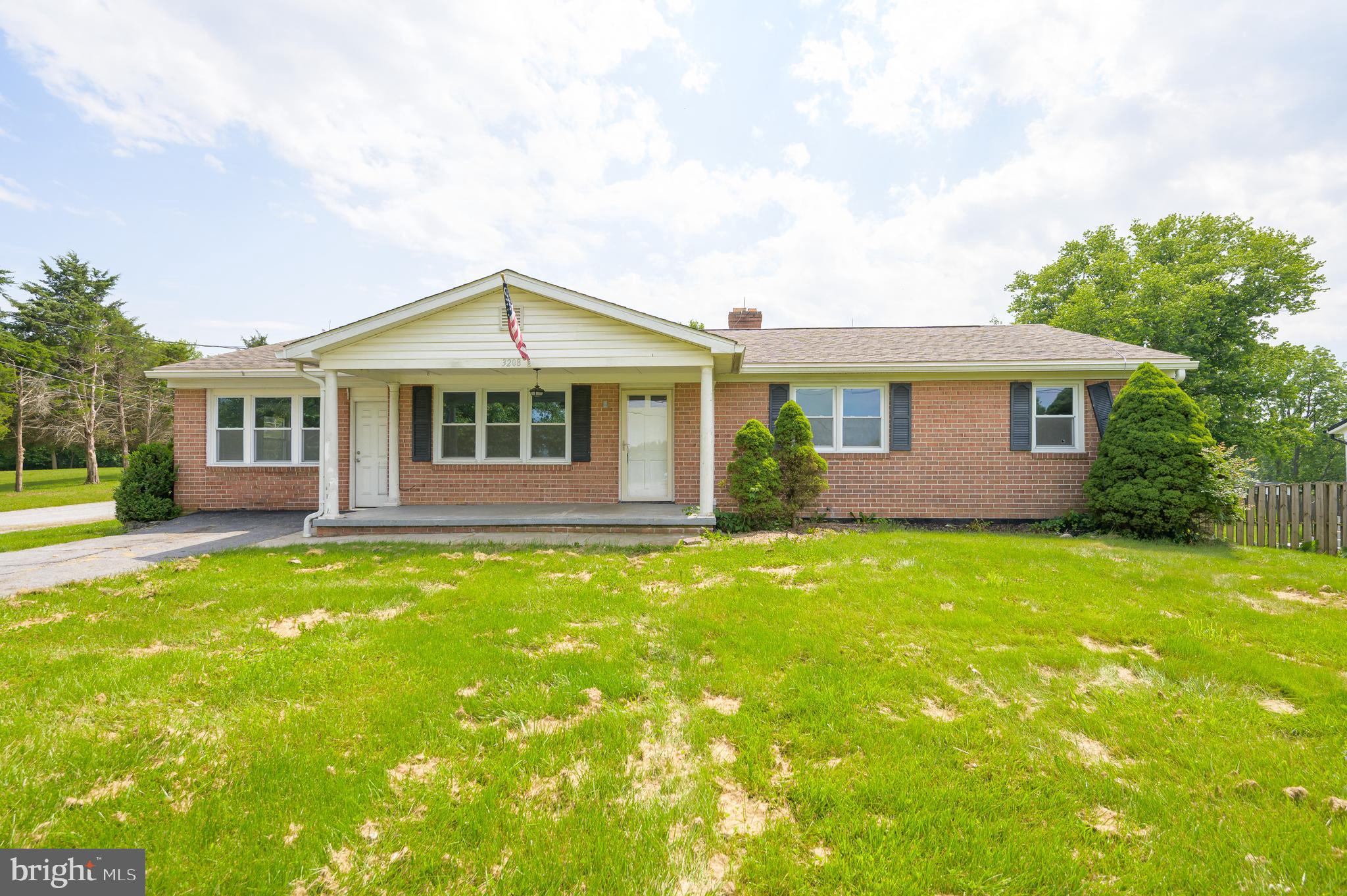 3208 Old Leetown Pike Ranson, WV 25438 - Photo 4 of 48 a front view of a house with a yard