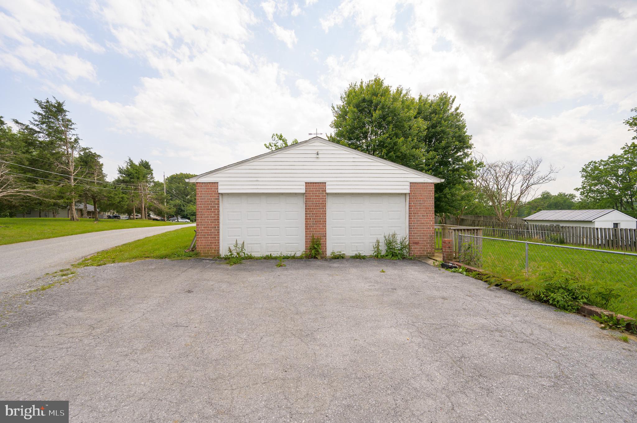 3208 Old Leetown Pike Ranson, WV 25438 - Photo 44 of 48 a view of a house with backyard and bushes