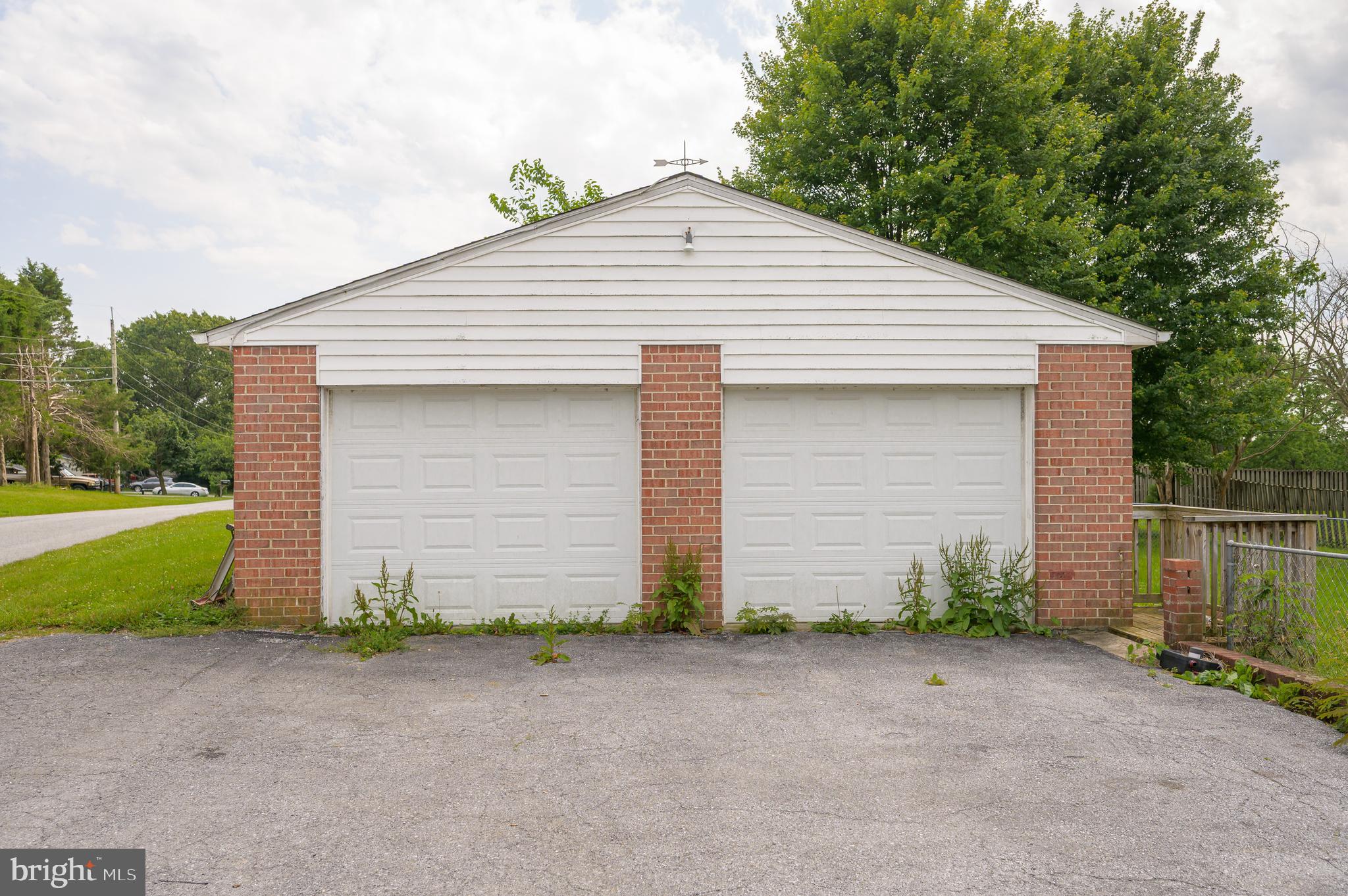 3208 Old Leetown Pike Ranson, WV 25438 - Photo 45 of 48 a front view of house with garage and yard