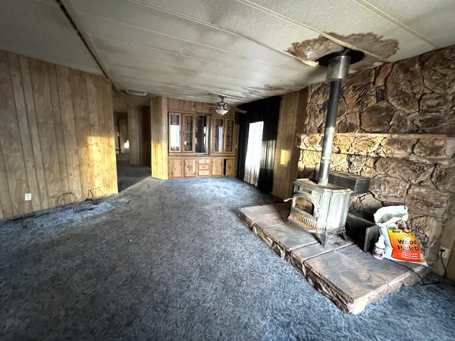 a kitchen with refrigerator and window
