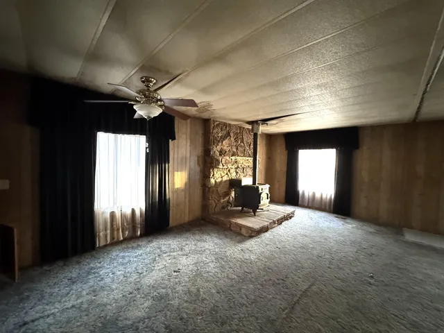 a kitchen with granite countertop cabinets and stove top oven