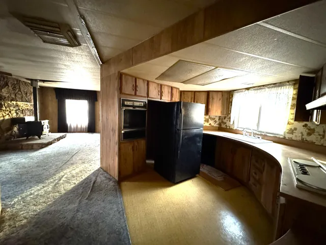 a view of a hallway with wooden shelves