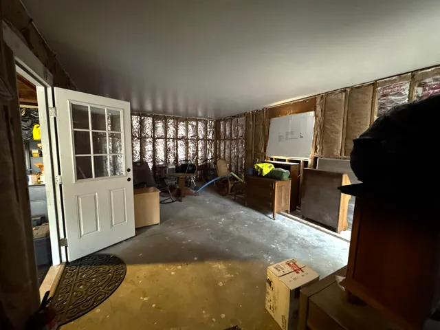 a view of a house with a yard and garage