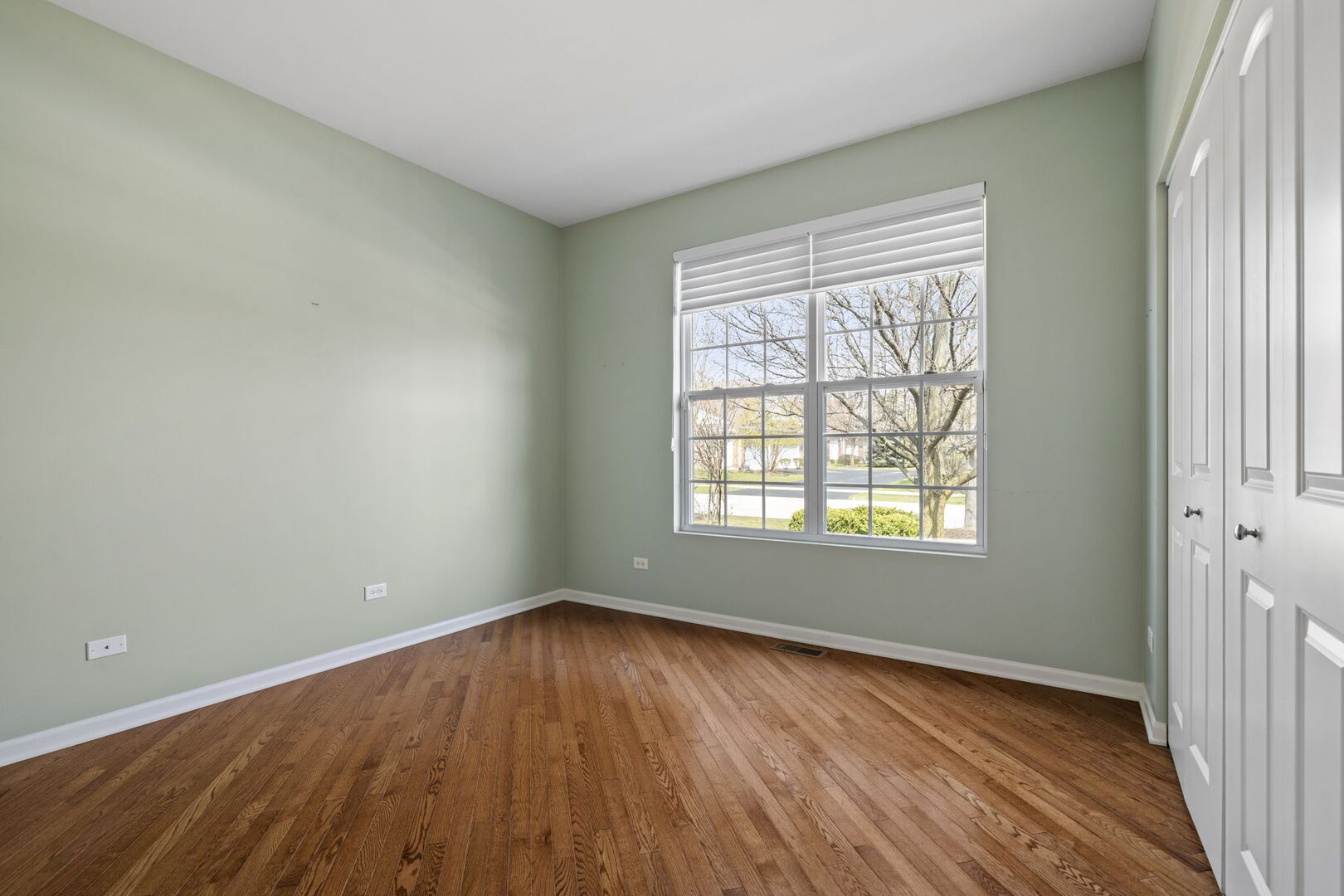 2845 Bond Circle Naperville, IL 60563 - Photo 12 of 27 an empty room with wooden floor and windows