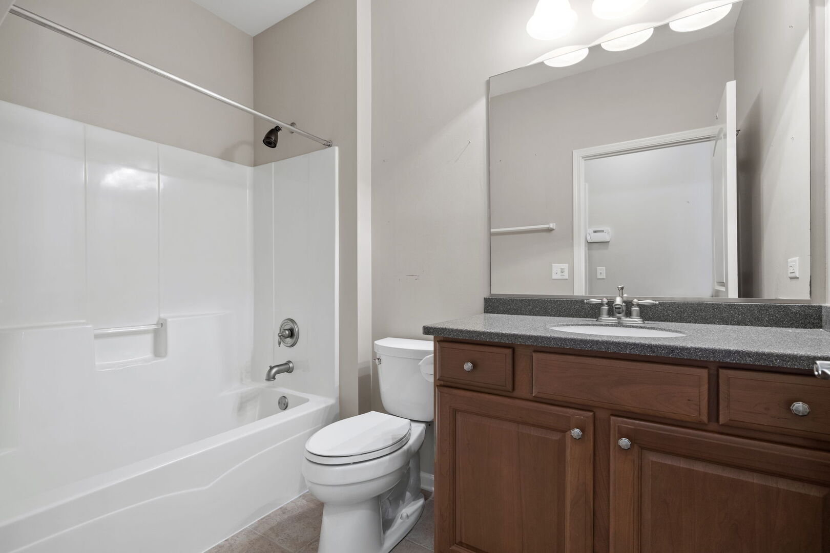 2845 Bond Circle Naperville, IL 60563 - Photo 13 of 27 a bathroom with a toilet a sink a mirror a bathtub and vanity