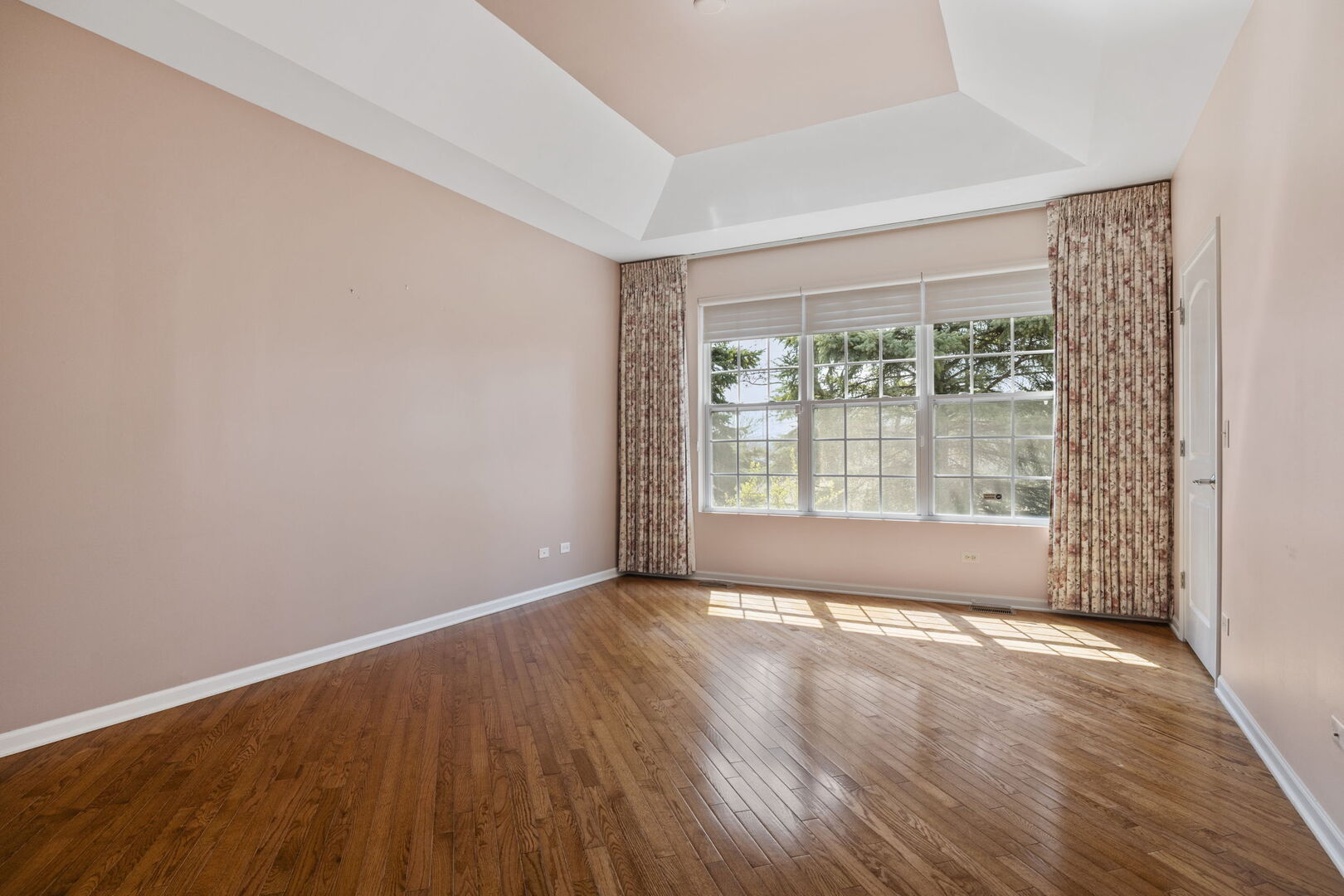 2845 Bond Circle Naperville, IL 60563 - Photo 15 of 27 a view of an empty room with wooden floor and a window