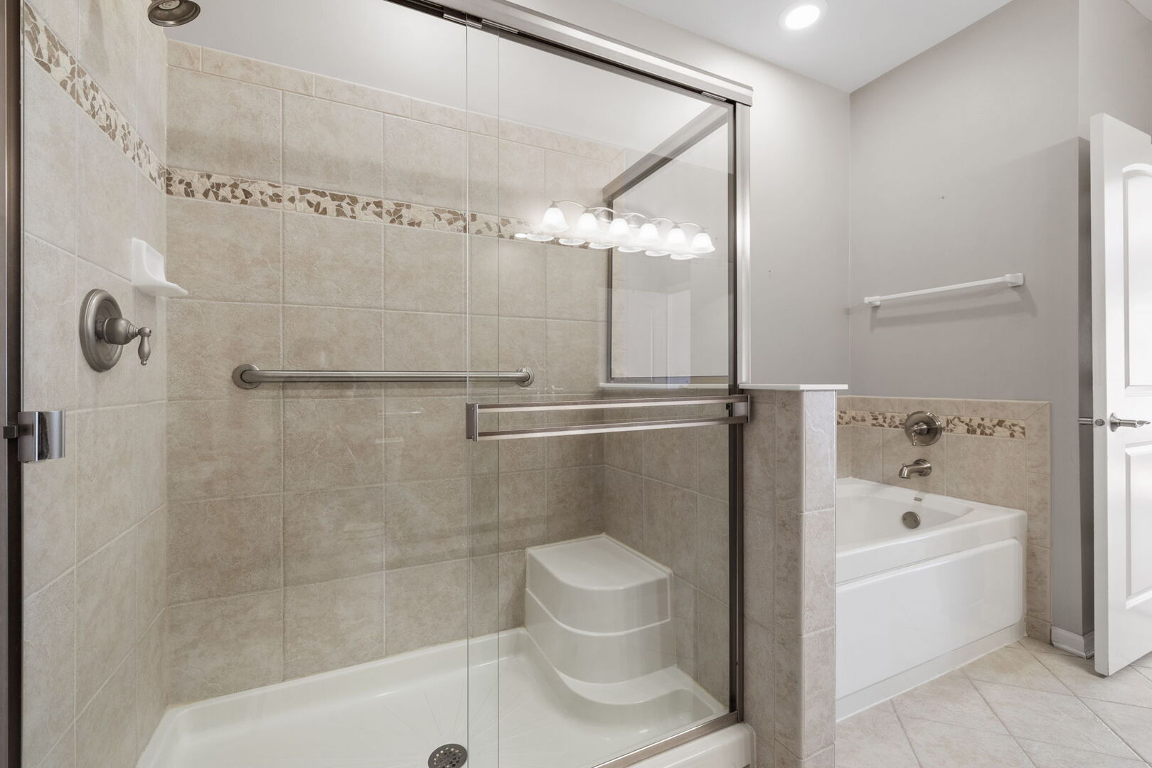 2845 Bond Circle Naperville, IL 60563 - Photo 19 of 27 a bathroom with a bathtub and a shower