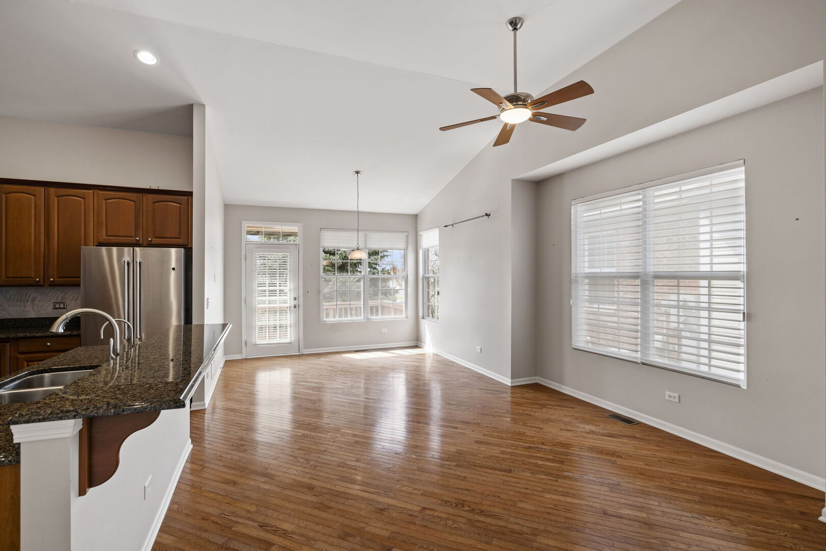 2845 Bond Circle Naperville, IL 60563 - Photo 3 of 27 a view of an empty room with a window and wooden floor