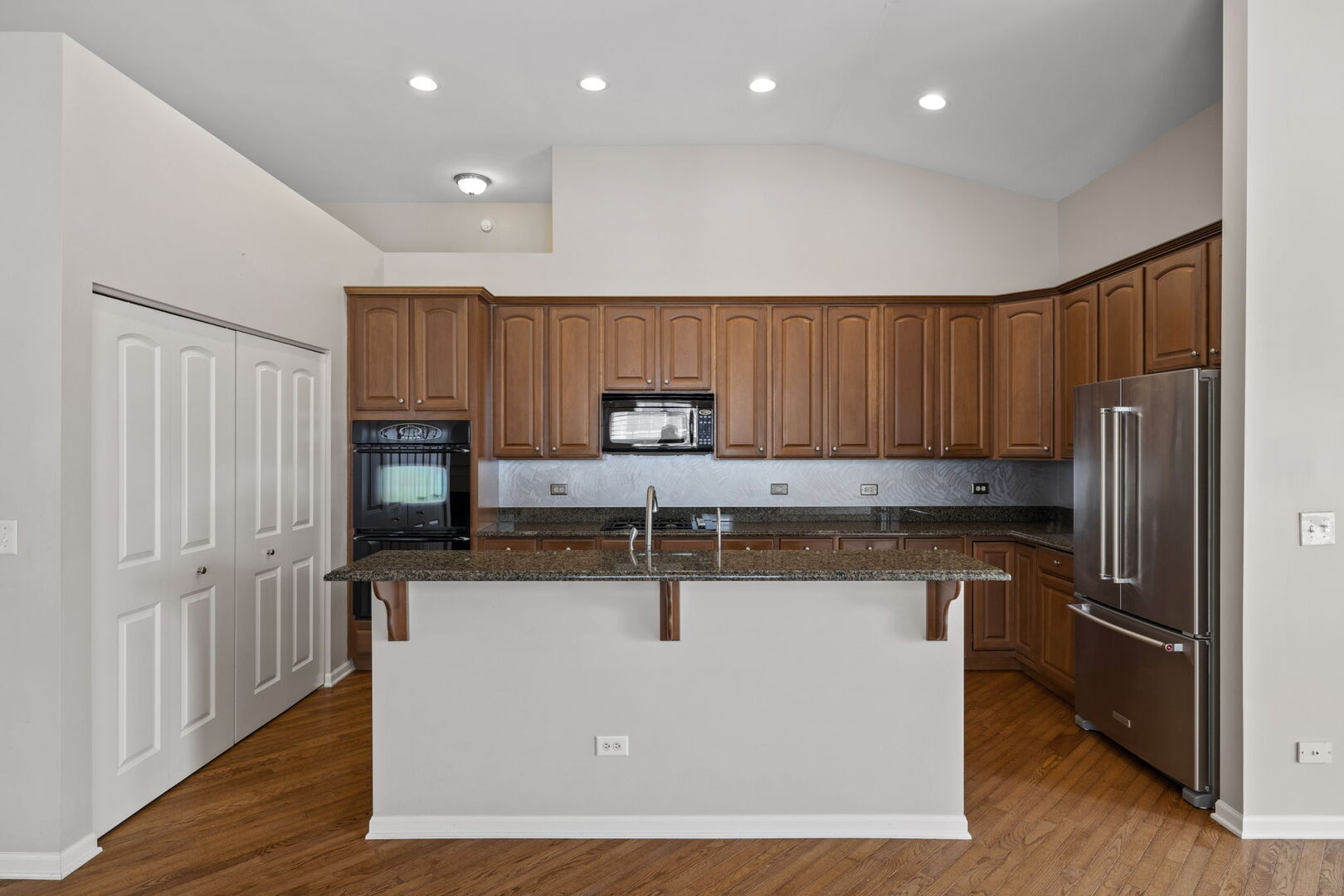 2845 Bond Circle Naperville, IL 60563 - Photo 4 of 27 a kitchen with stainless steel appliances granite countertop a refrigerator a sink and a stove