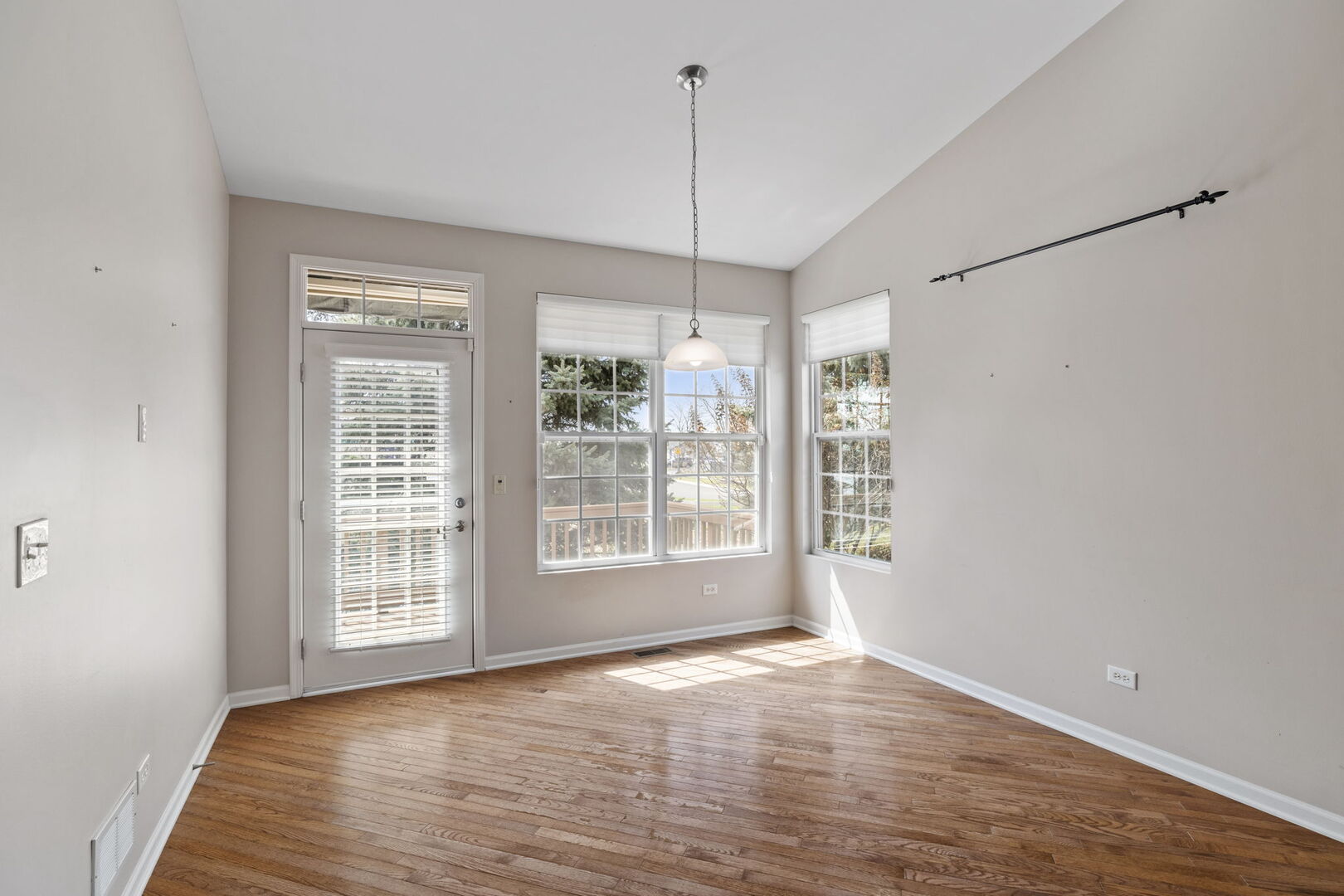 2845 Bond Circle Naperville, IL 60563 - Photo 6 of 27 a view of empty room with wooden floor and fan