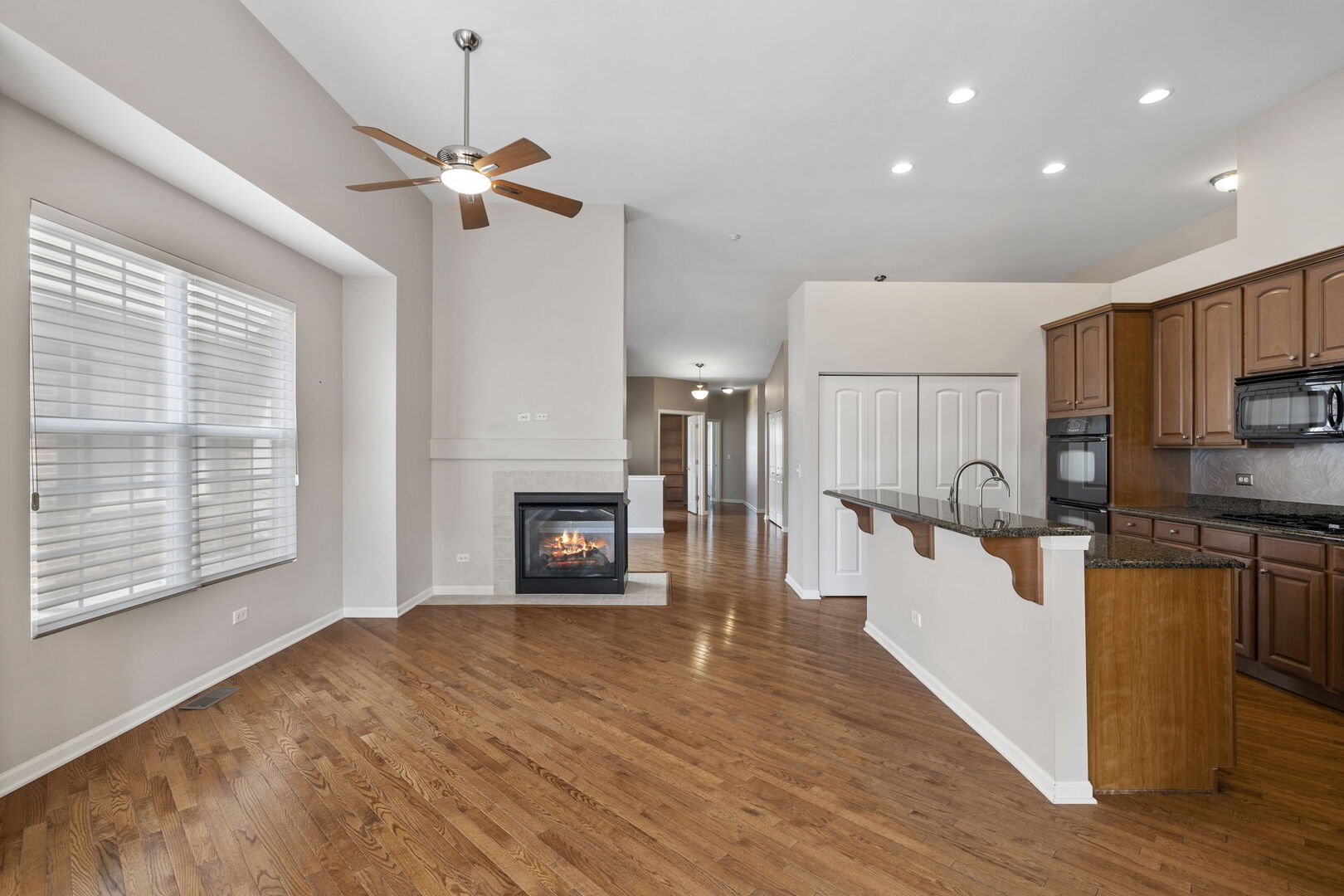 2845 Bond Circle Naperville, IL 60563 - Photo 7 of 27 a kitchen with stainless steel appliances a refrigerator sink and wooden floor