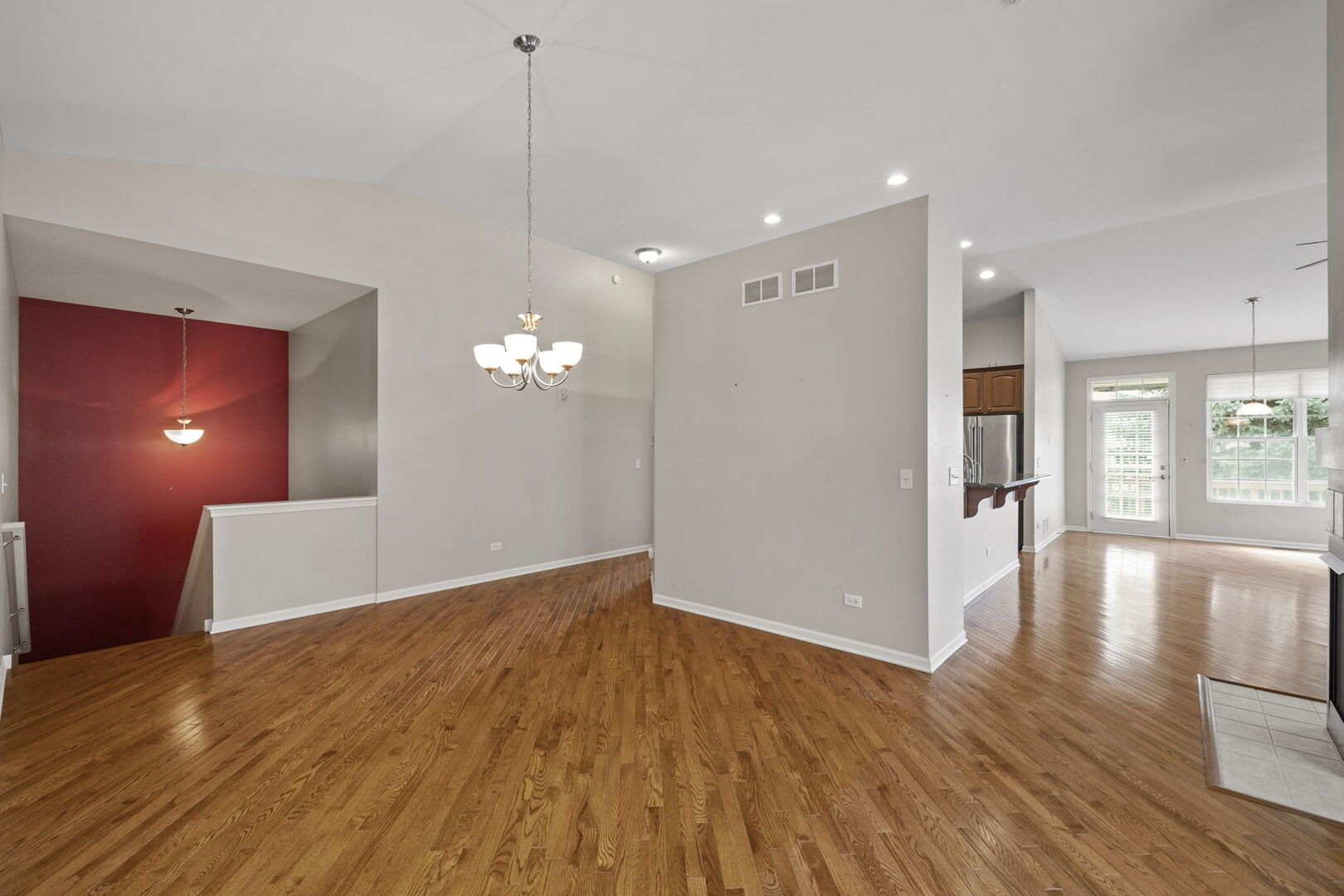 2845 Bond Circle Naperville, IL 60563 - Photo 10 of 27 a view of a room with wooden floor and kitchen view