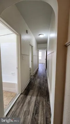 a bath tub sitting next to a white sink