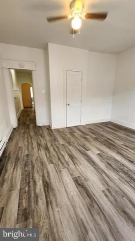 a view of a hallway view with wooden floor