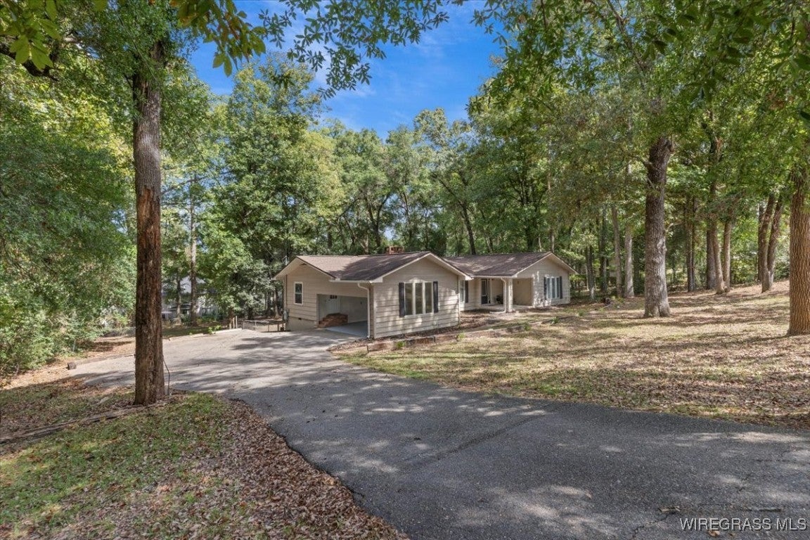 1706 Prestwood Bridge Road Andalusia, AL 36421 - Photo 3 of 33 The side view with driveway
