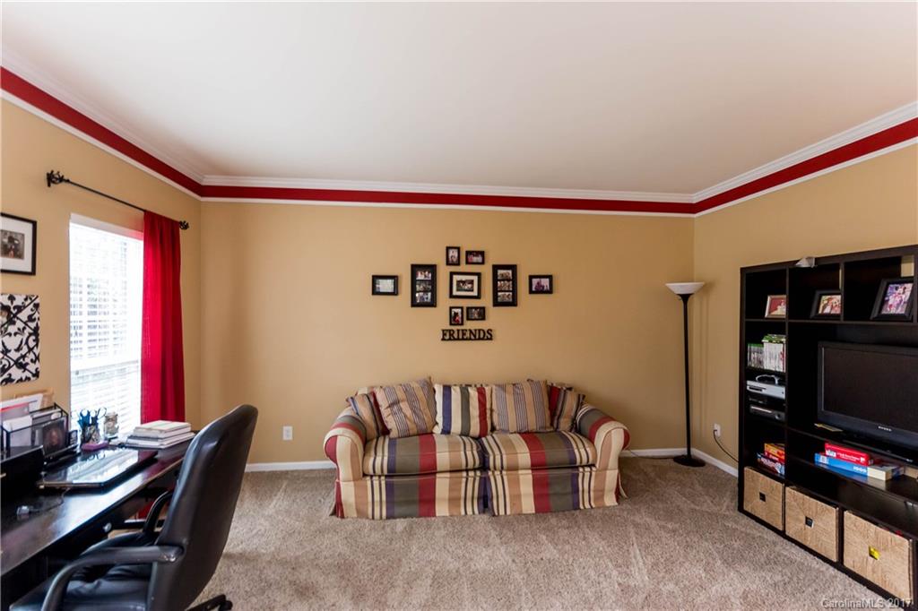 5556 Alexandrite Way Fort Mill, SC 29708 - Photo 2 of 20 a living room with furniture and a flat screen tv