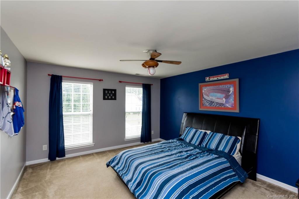 5556 Alexandrite Way Fort Mill, SC 29708 - Photo 11 of 20 a bedroom with a bed and a window