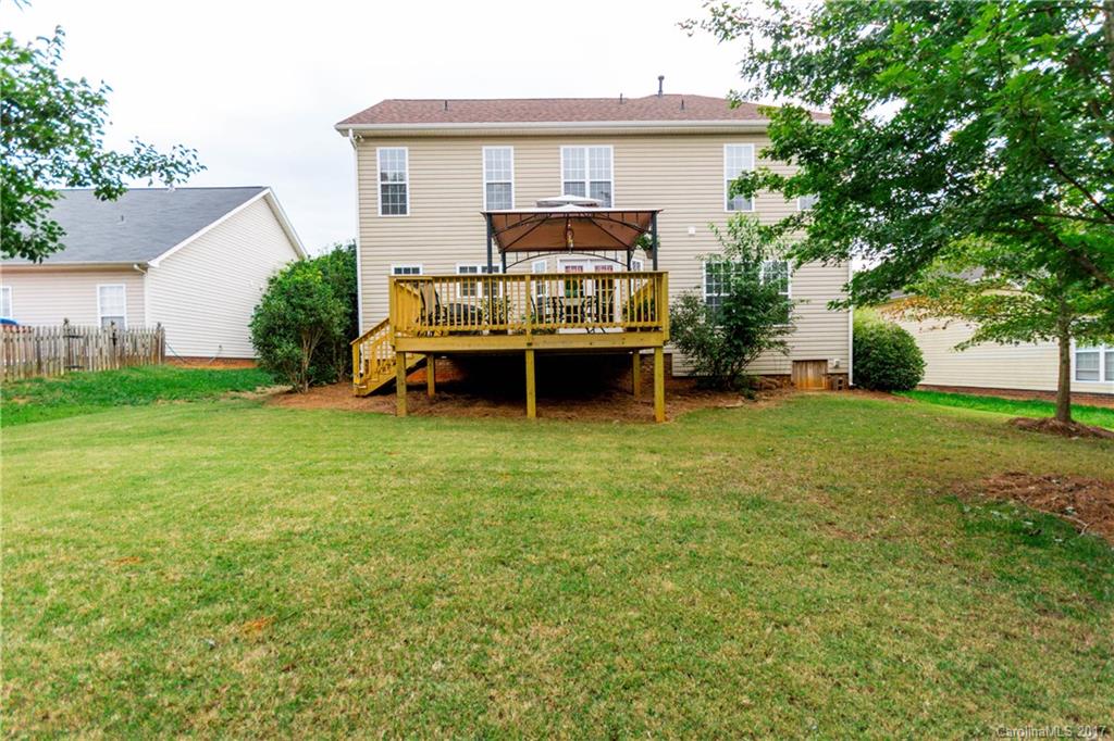 5556 Alexandrite Way Fort Mill, SC 29708 - Photo 19 of 20 a view of a house with a yard and sitting area