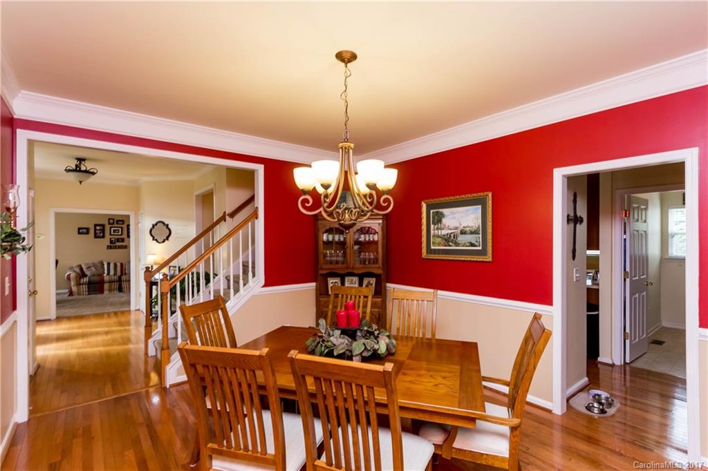 5556 Alexandrite Way Fort Mill, SC 29708 - Photo 4 of 20 a view of a dining room with furniture wooden floor and chandelier