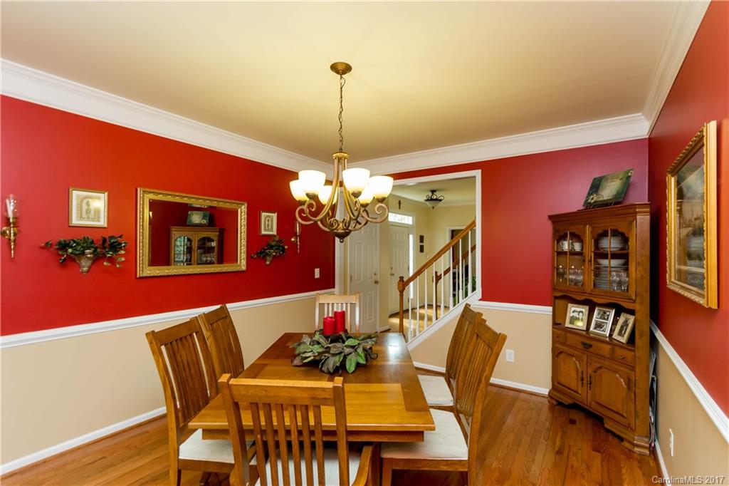 5556 Alexandrite Way Fort Mill, SC 29708 - Photo 5 of 20 a view of a dining room with furniture and chandelier