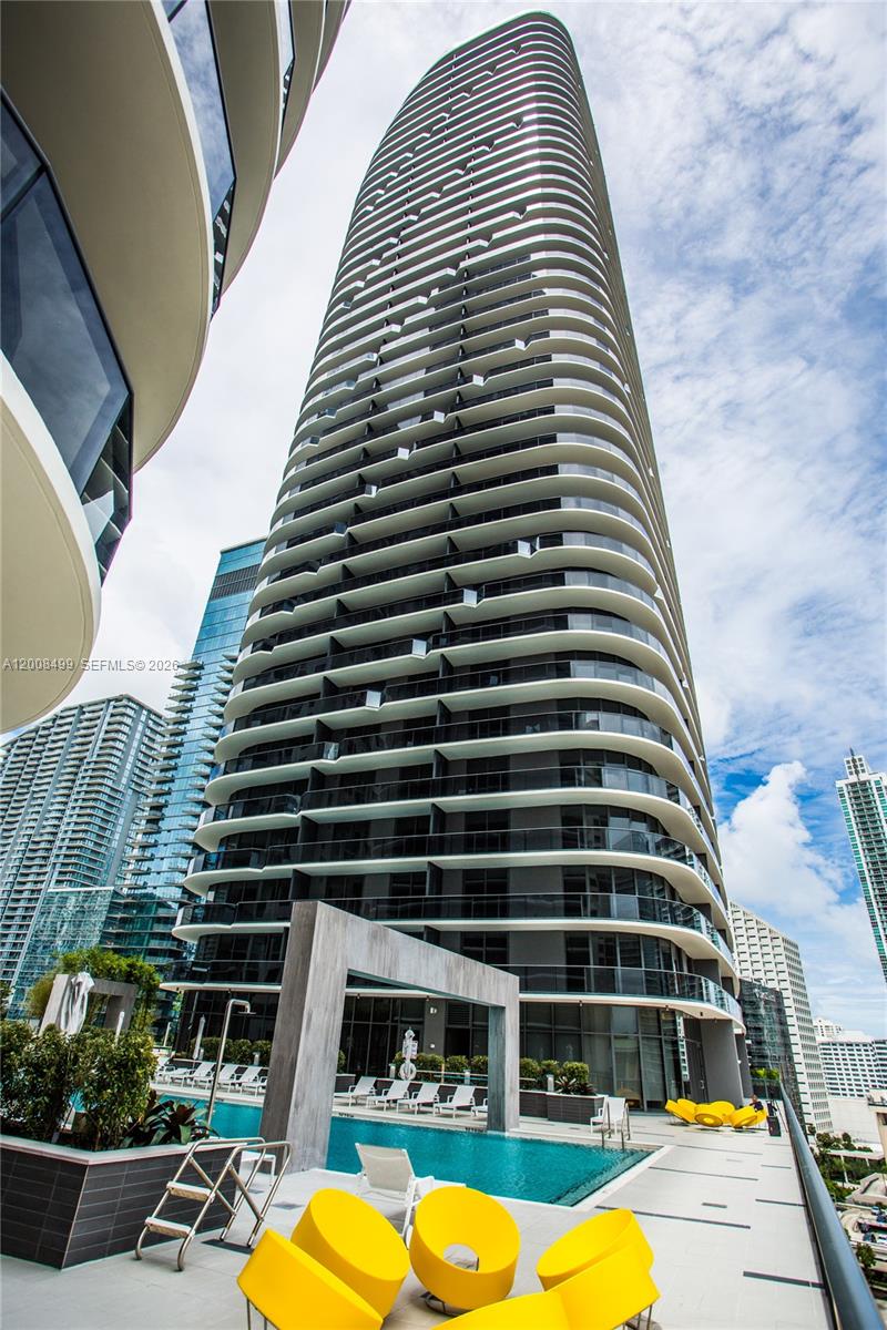55 Southwest 9th Street, Unit 2702 Miami, FL 33130 - Photo 17 of 36 a view of a balcony with chairs