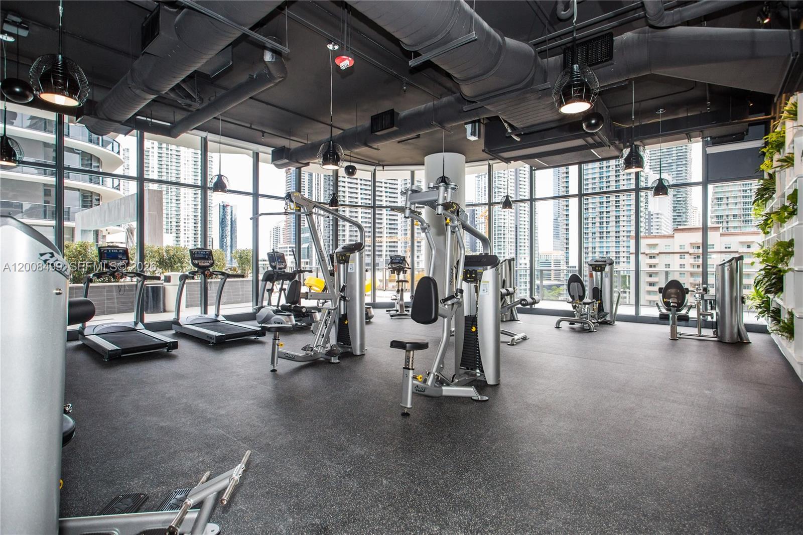 55 Southwest 9th Street, Unit 2702 Miami, FL 33130 - Photo 18 of 36 a view of a room with gym equipment