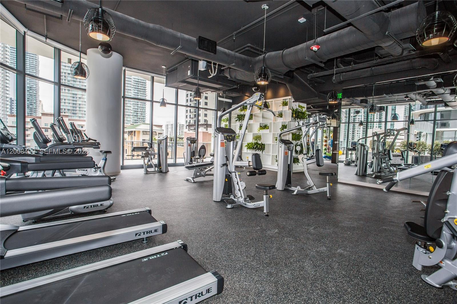 55 Southwest 9th Street, Unit 2702 Miami, FL 33130 - Photo 19 of 36 a view of a room with gym equipment
