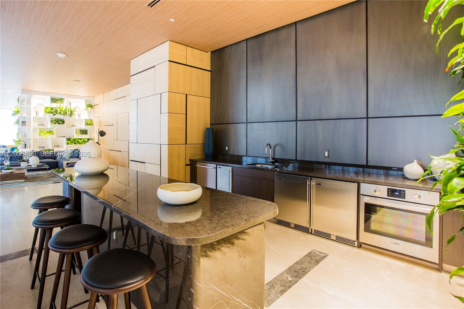 55 Southwest 9th Street, Unit 2702 Miami, FL 33130 - Photo 26 of 36 a kitchen with a table and chairs in it