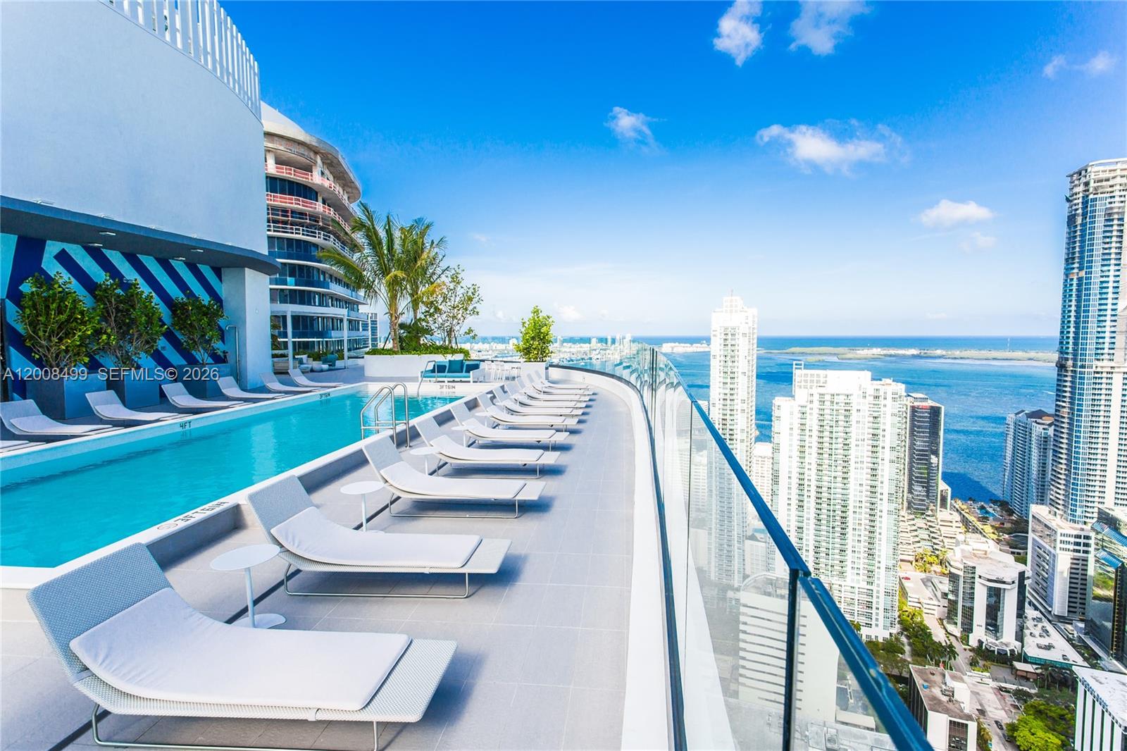 55 Southwest 9th Street, Unit 2702 Miami, FL 33130 - Photo 31 of 36 a view of an chairs and tables in patio