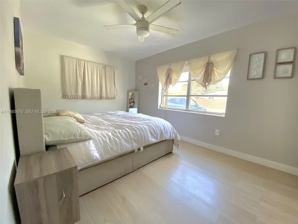 a bedroom with a bed and window